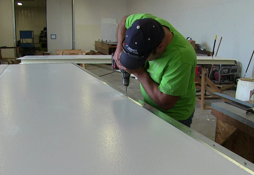 Fabricating doors in shop Fabricating doors in shop
